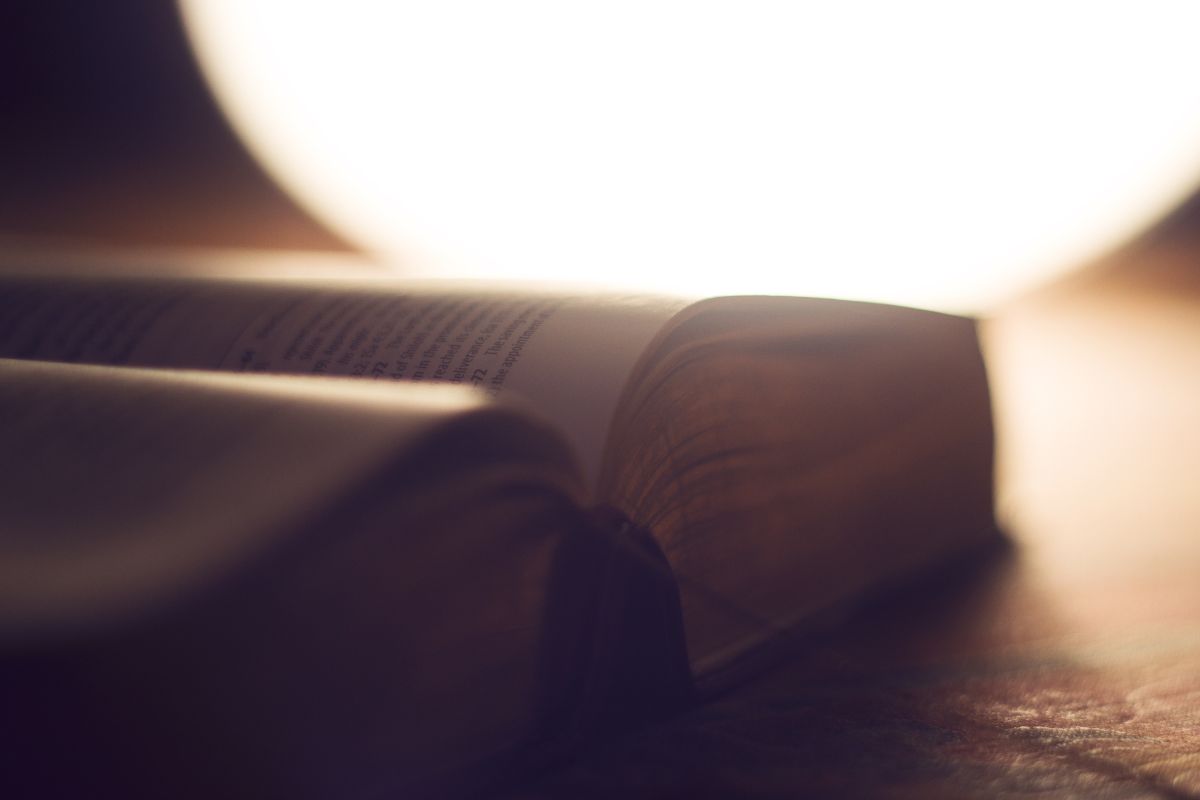 pen Bible with warm light symbolizing truth and belief